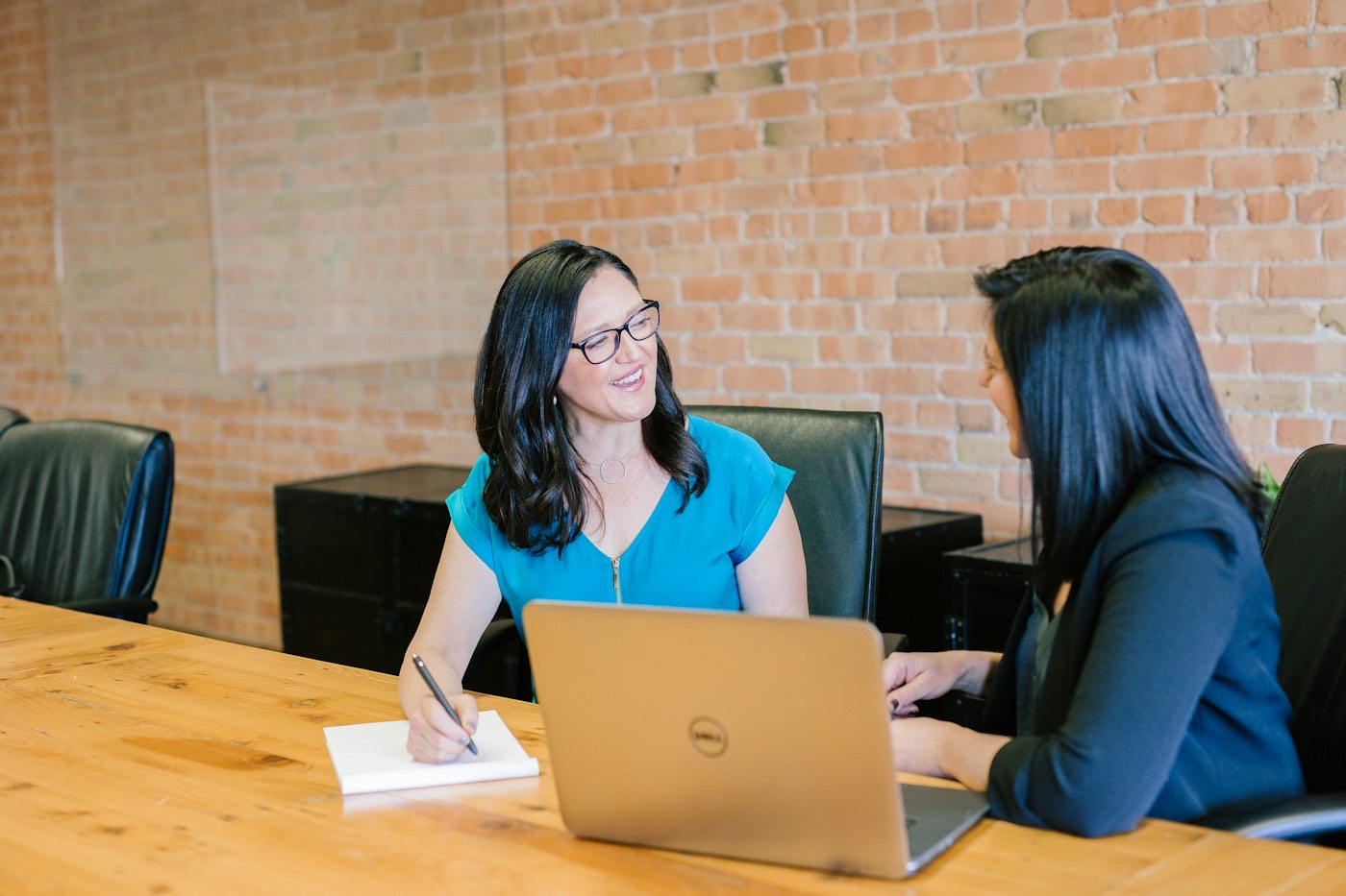A migration lawyer talking a client through their options
