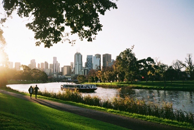 A couple walking along the Yarra River in Melbourne